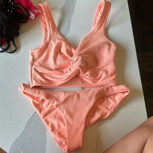 Beach Bunny, small top medium bottom colors, kind of like a sherbet pinkish